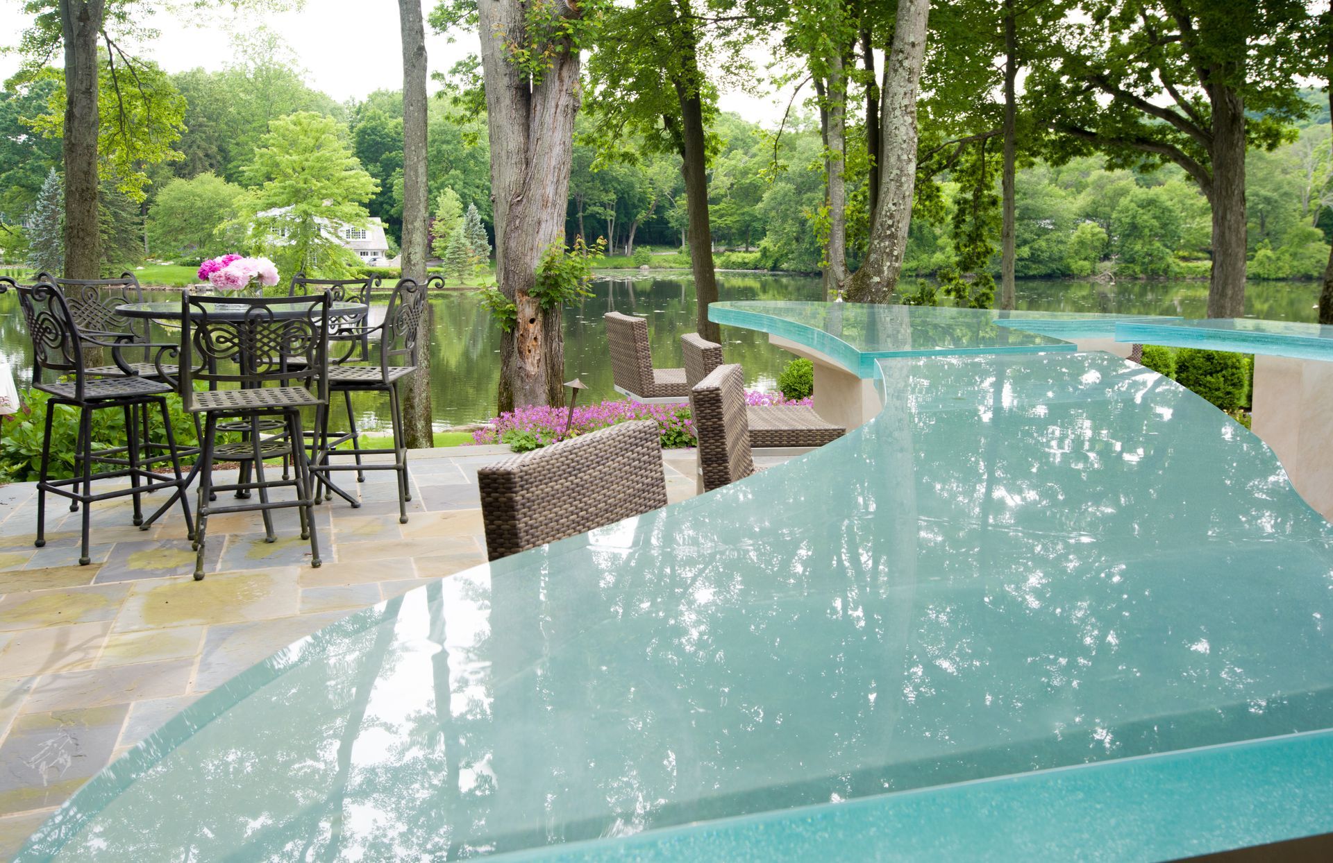 A glass countertop cut to a custom shape for an outdoor bar in a private residence. A glass countertop cut to a custom shape for an outdoor bar in a private residence.