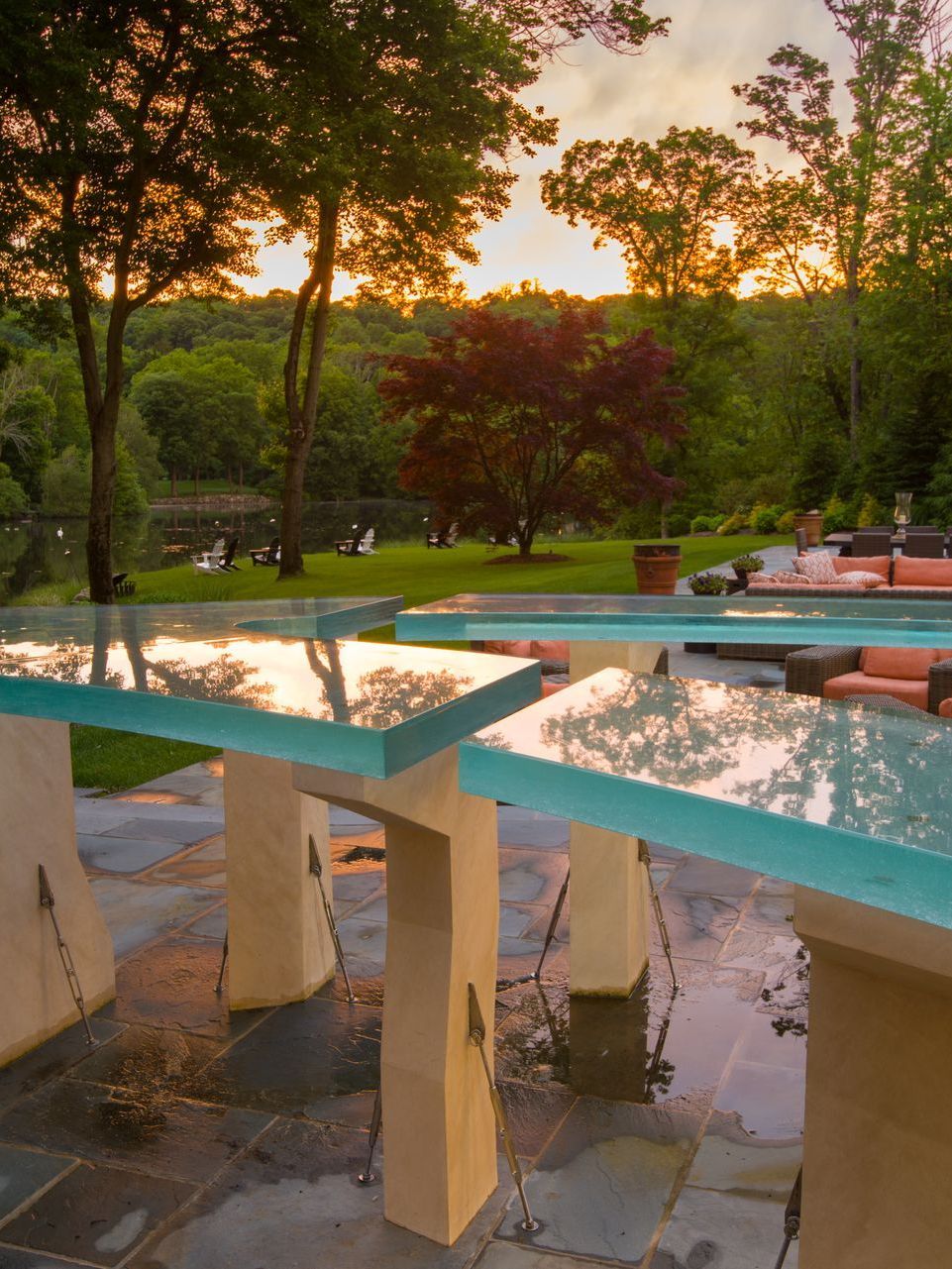 Curved glass countertops in an outdoor living space. Curved glass countertops in an outdoor living space.