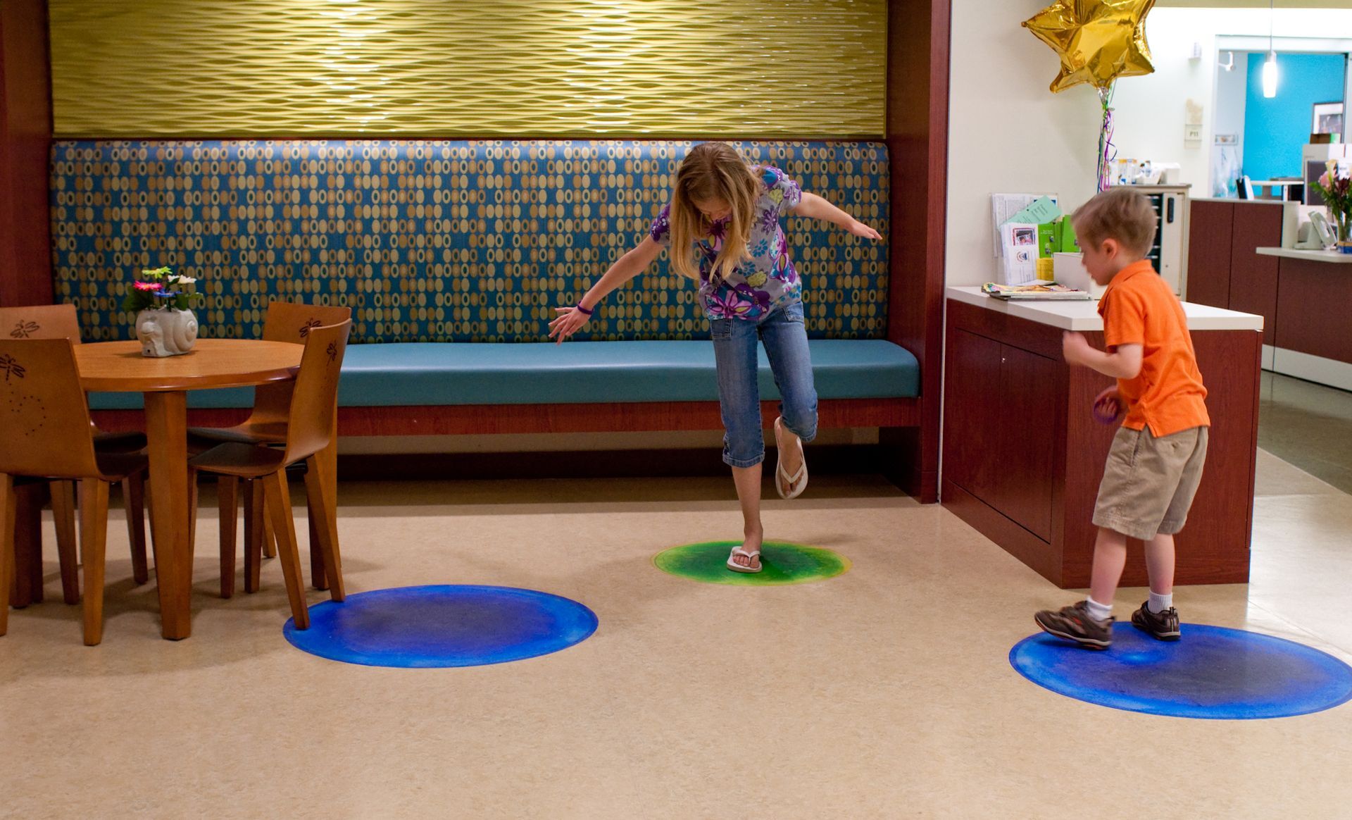 Children jumping on the Liquid Lava tiles in delight. Children jumping on the Liquid Lava tiles in delight.