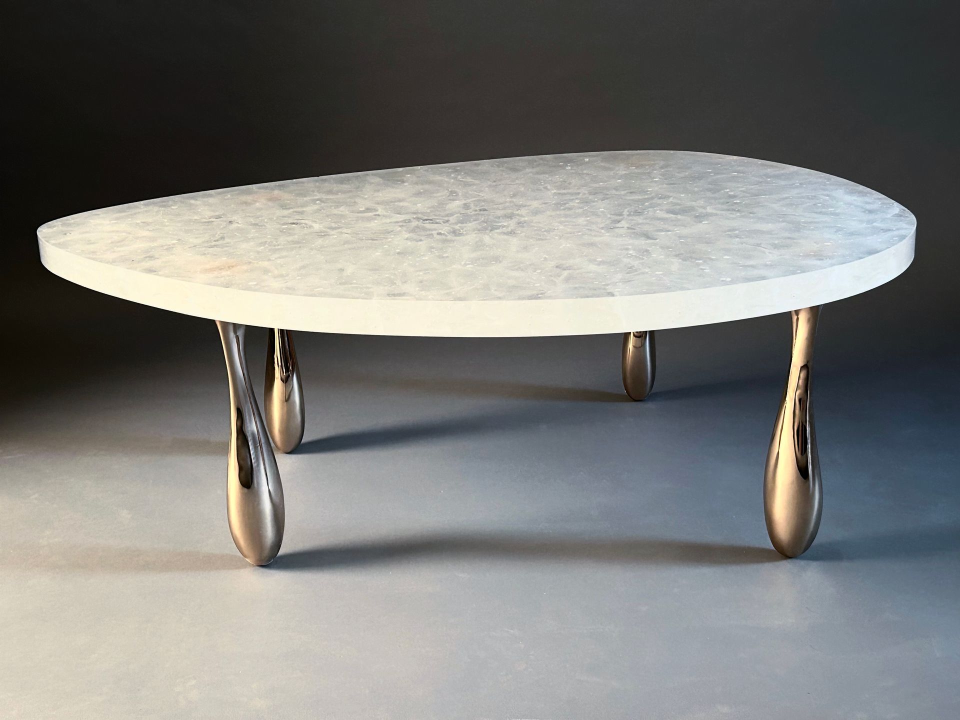 A THICK glass round table.