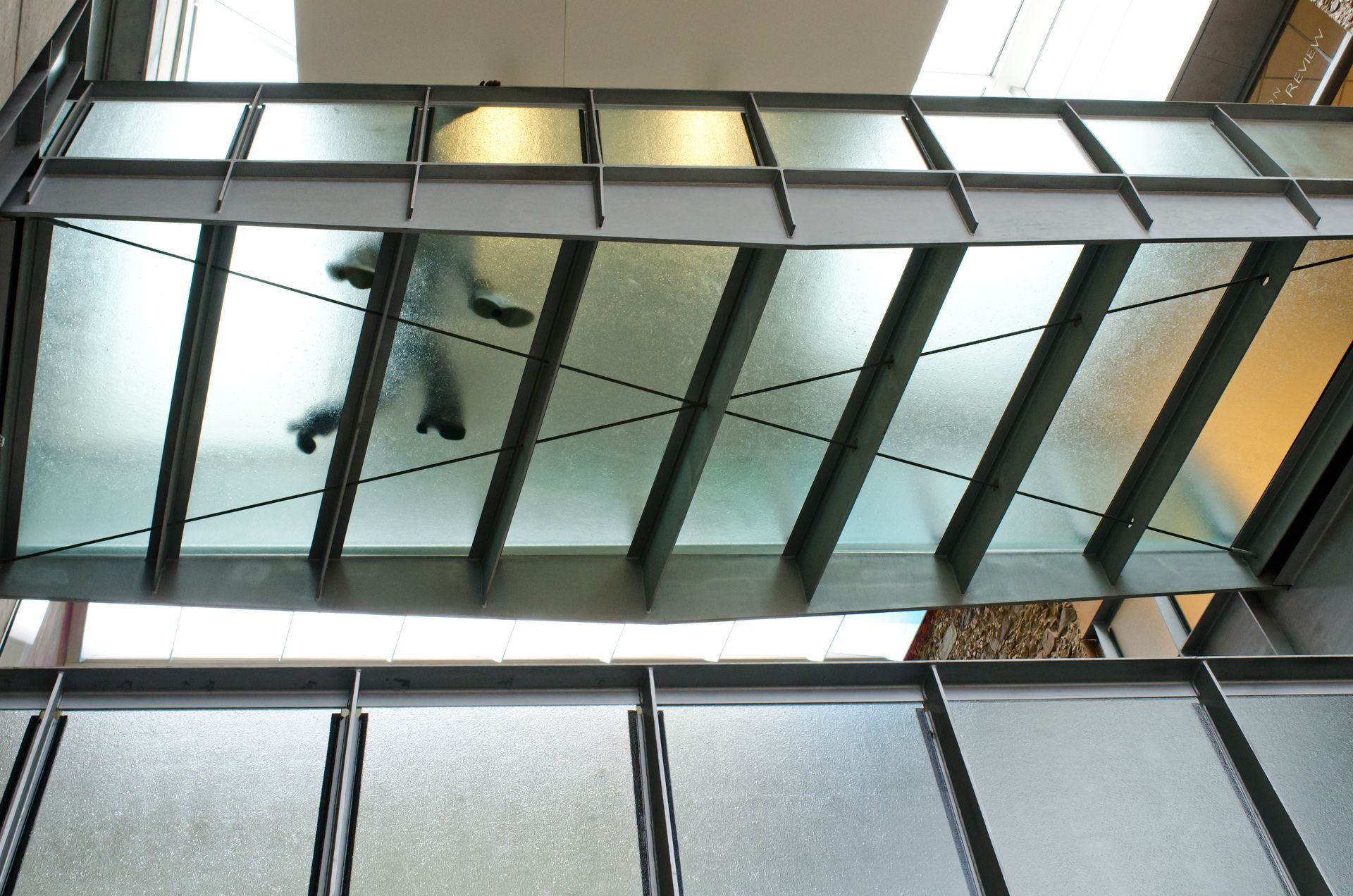 A pedestrian bridge using glass flooring. A pedestrian bridge using glass flooring.