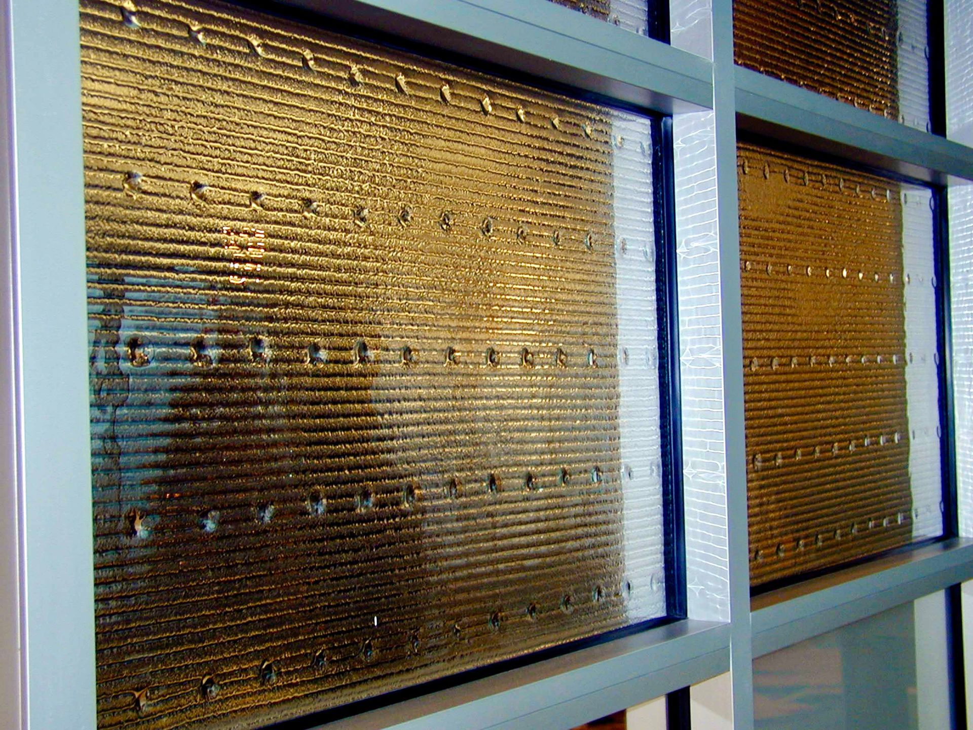 Textured glass panels within a metal frame.