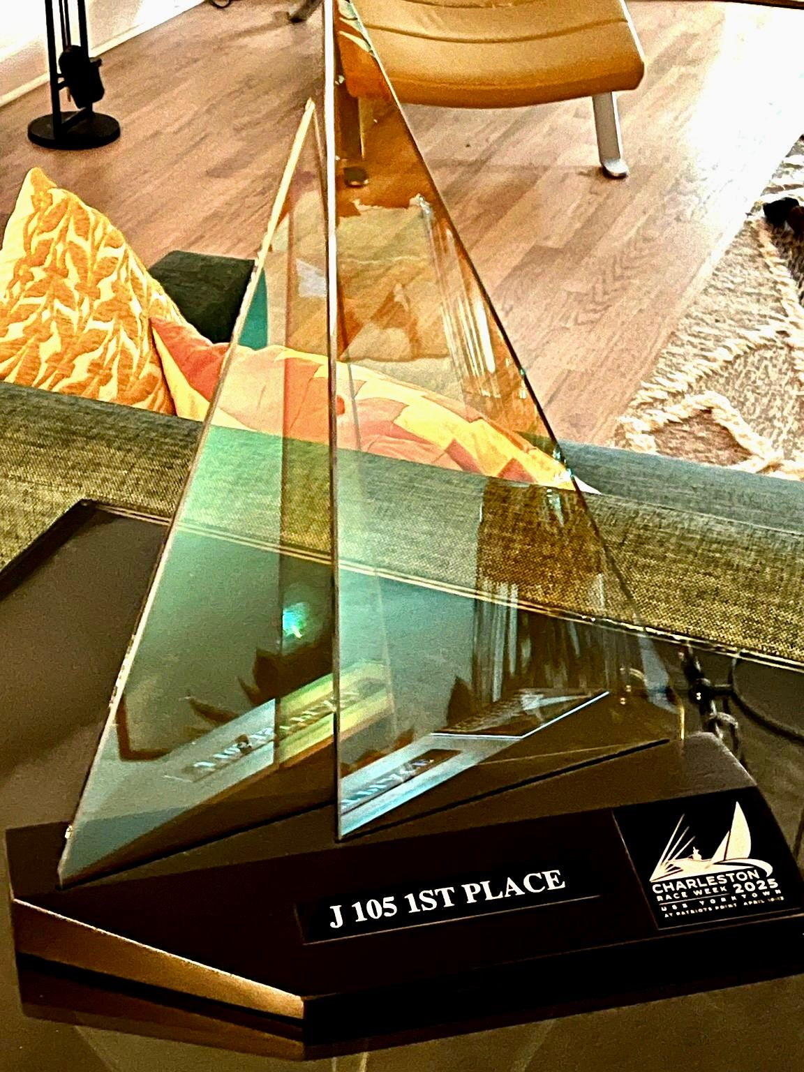 dichroic glass sailboat trophy on a wooden base, reads