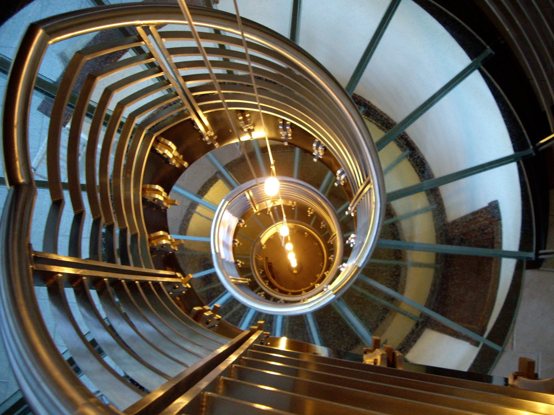 A spiral glass staircase. A spiral glass staircase.