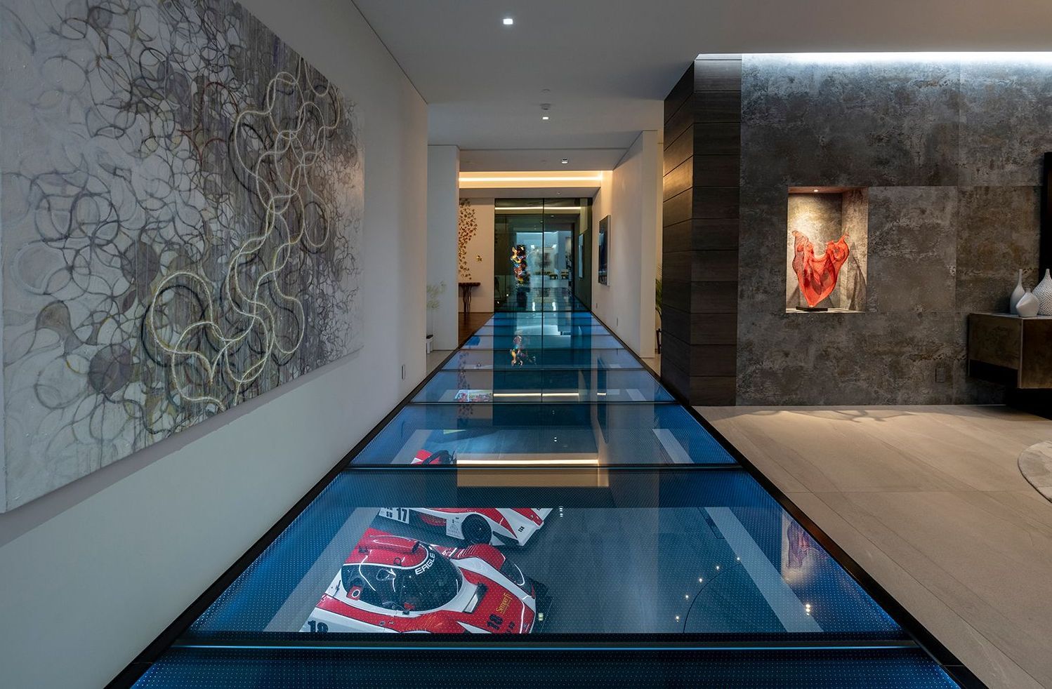 Glass floor with anti-slip coating revealing cars underneath Glass floor with anti-slip coating revealing cars underneath