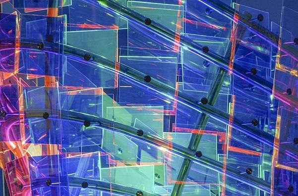 Abstract blue and purple geometric pattern with layered translucent shapes and neon lines