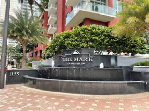 A black stone fountain featuring the sign