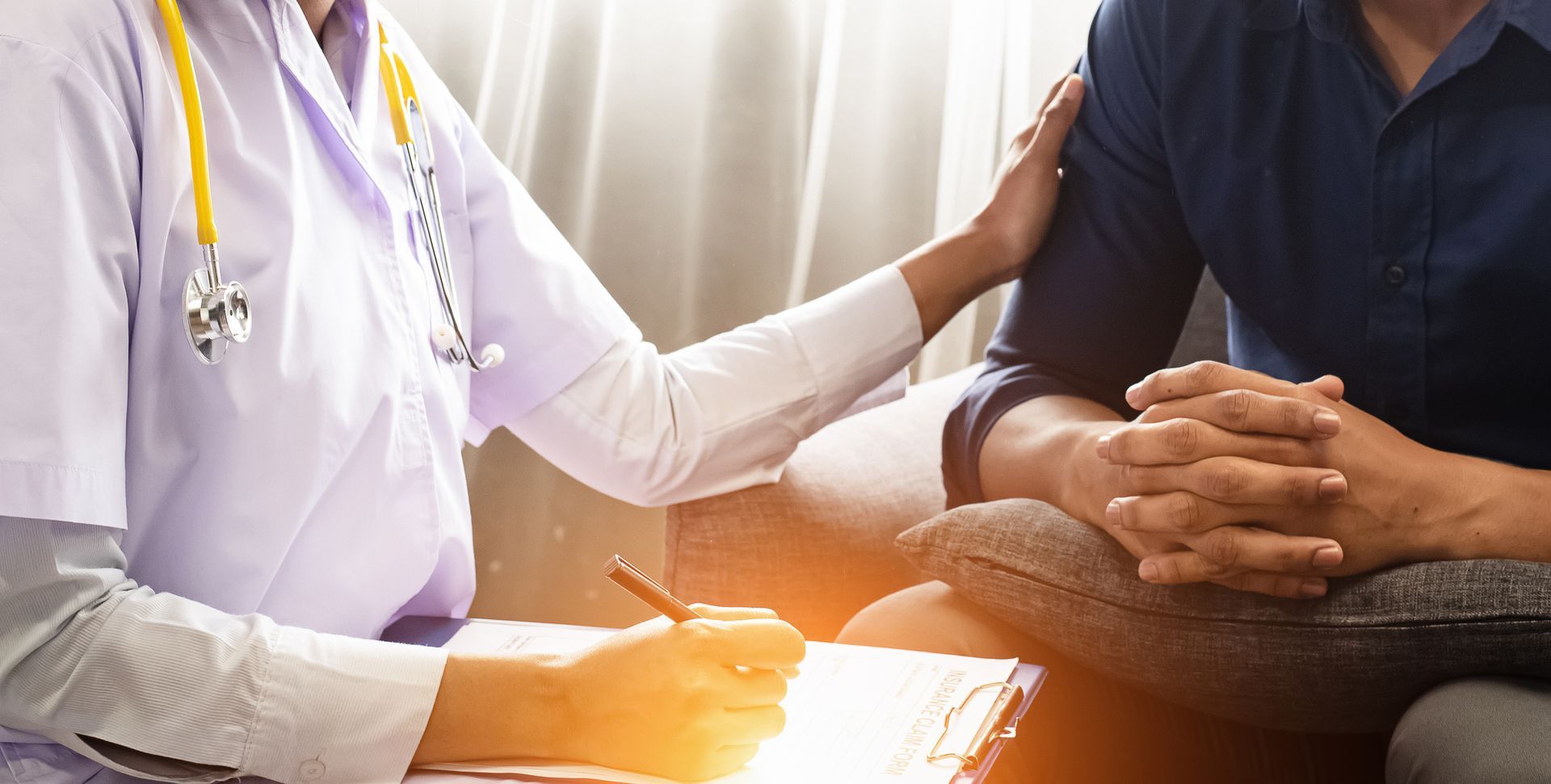 Doctor measuring patient's waist in a bright office. Fruits on desk. Doctor measuring patient's waist in a bright office. Fruits on desk.