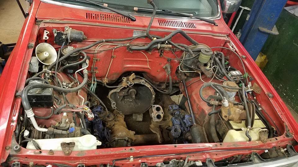 Red Vehicle Engine Bay During Auto Repair Service | Kabilian's Car Kare