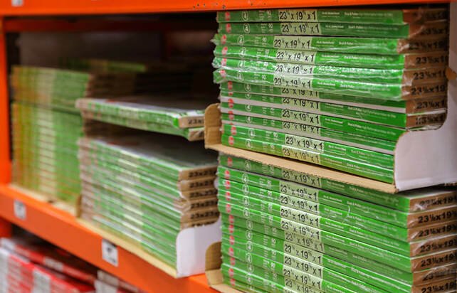 stacks of new furnace air filters on the shelf
