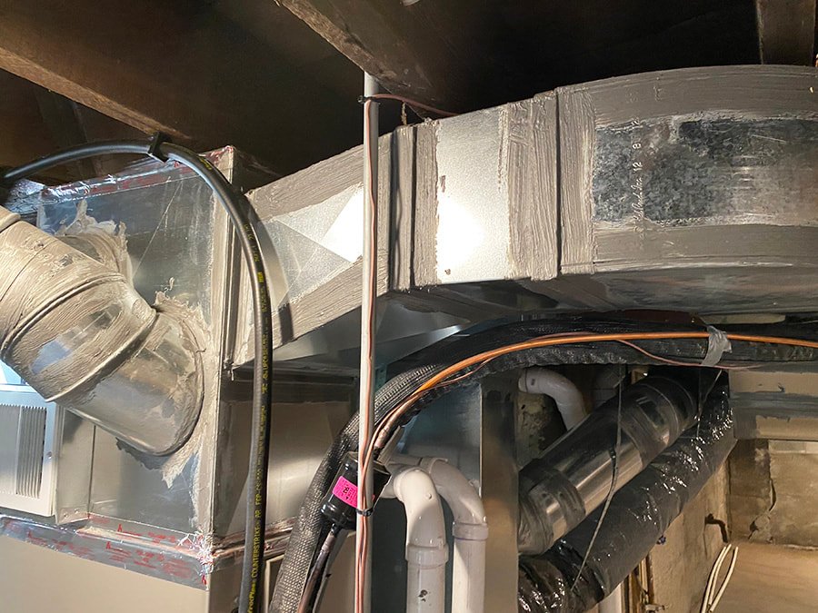 Duct work that has been damaged and repaired