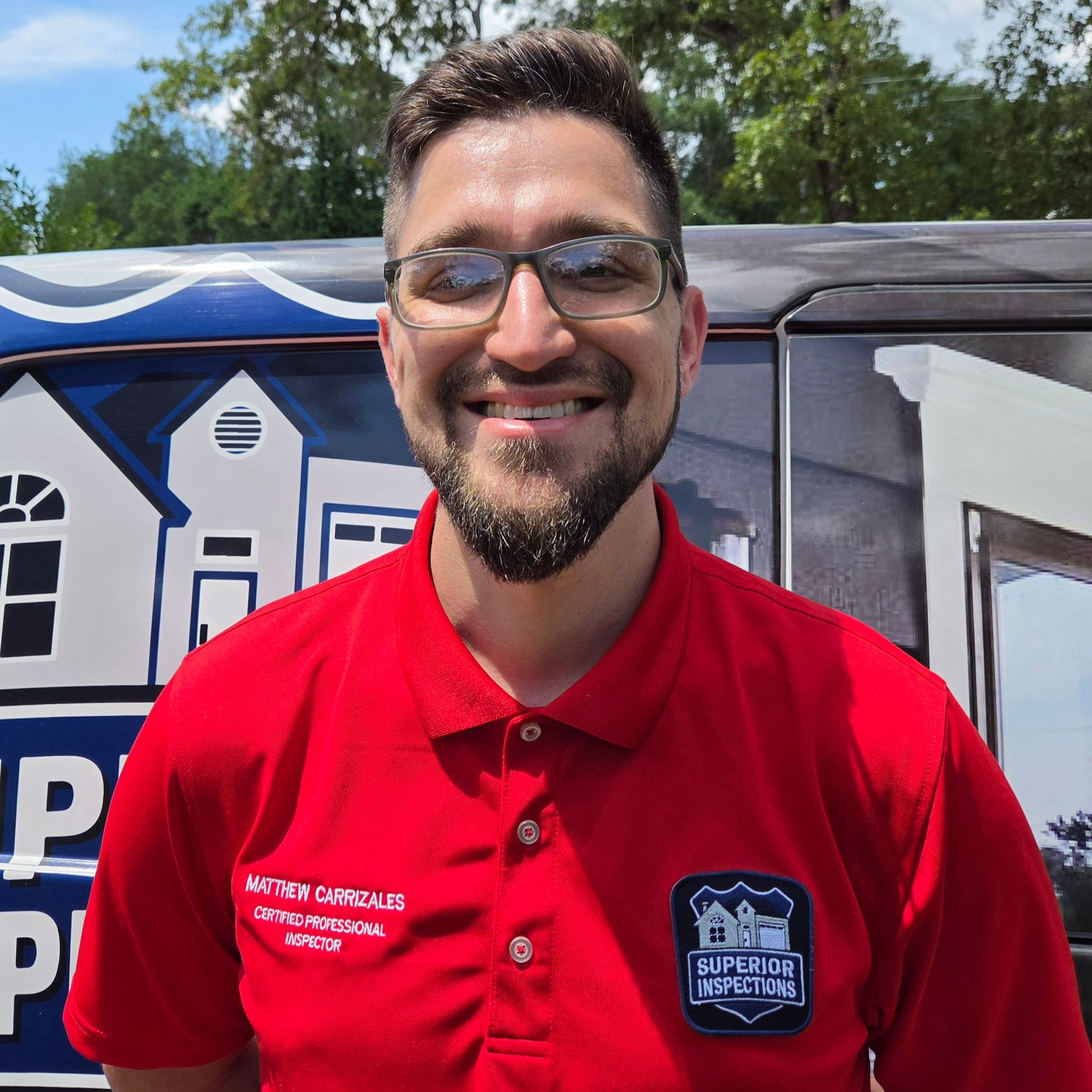 Certified home inspector standing beside an inspection vehicle