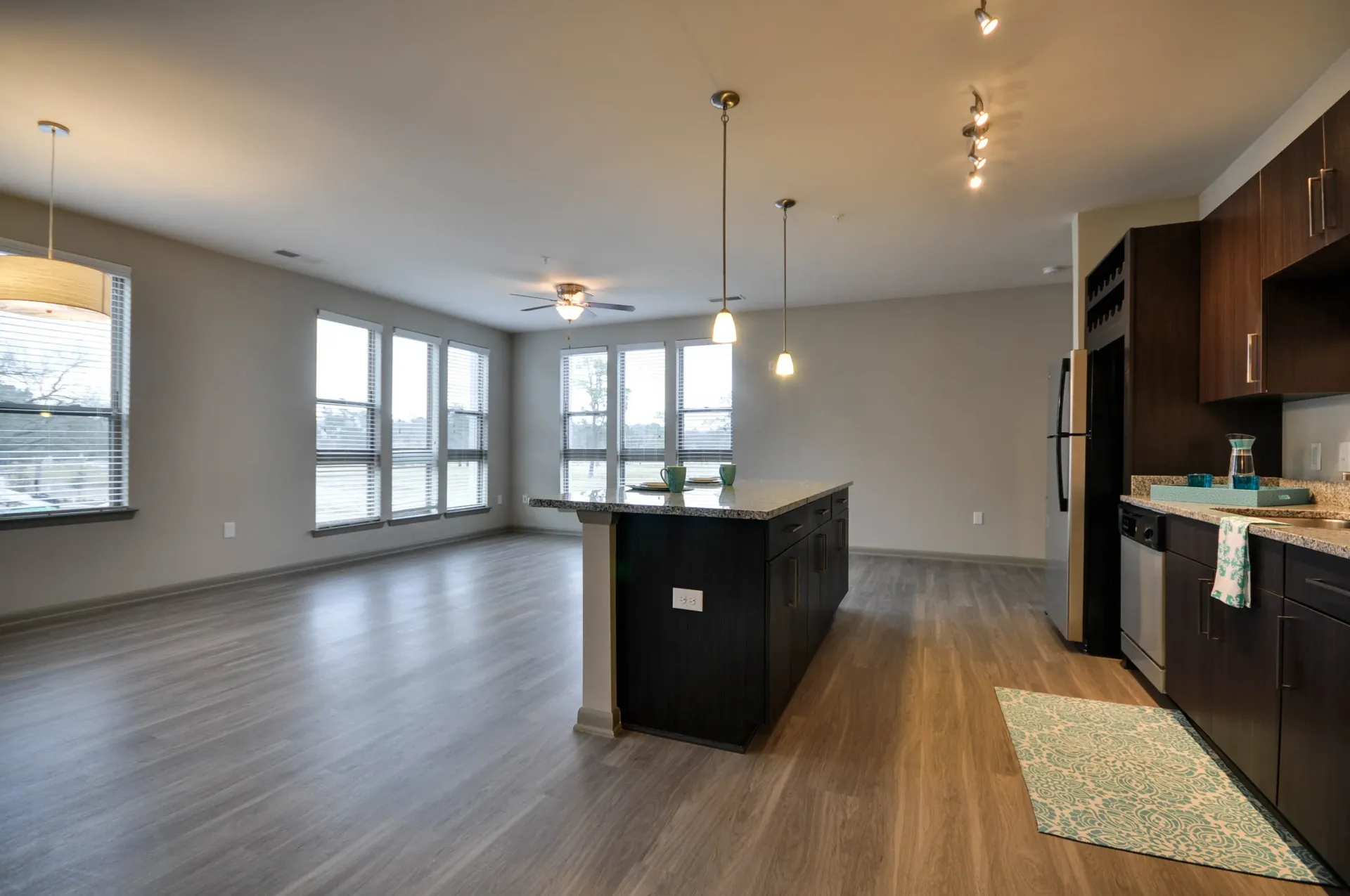 Spacious open-concept living area and kitchen with a large island.