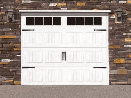 White garage door with four windows set in a stone exterior wall.