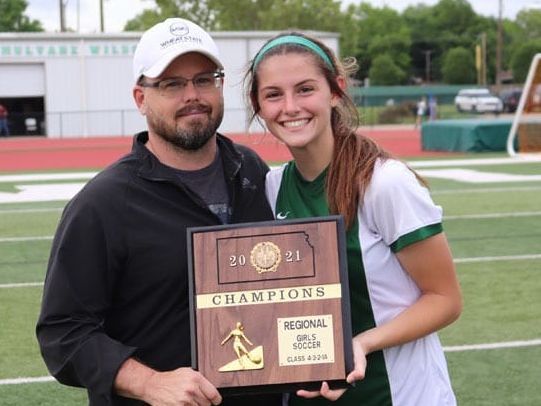 Kennton Hoffman, CEO of Wheat State Insurance Group celebrating with his daughter.