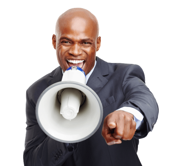 Man in suit using a megaphone, pointing forward, smiling.