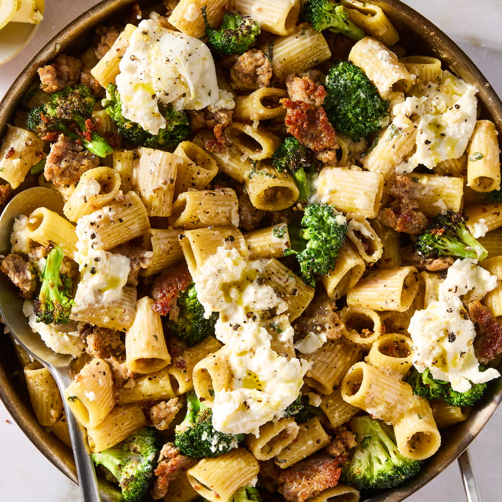Pasta dish with broccoli, sausage, and creamy burrata cheese.