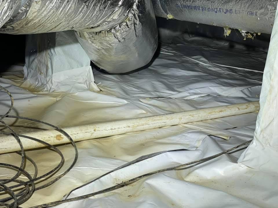 A bunch of wires are laying on the floor of a room.