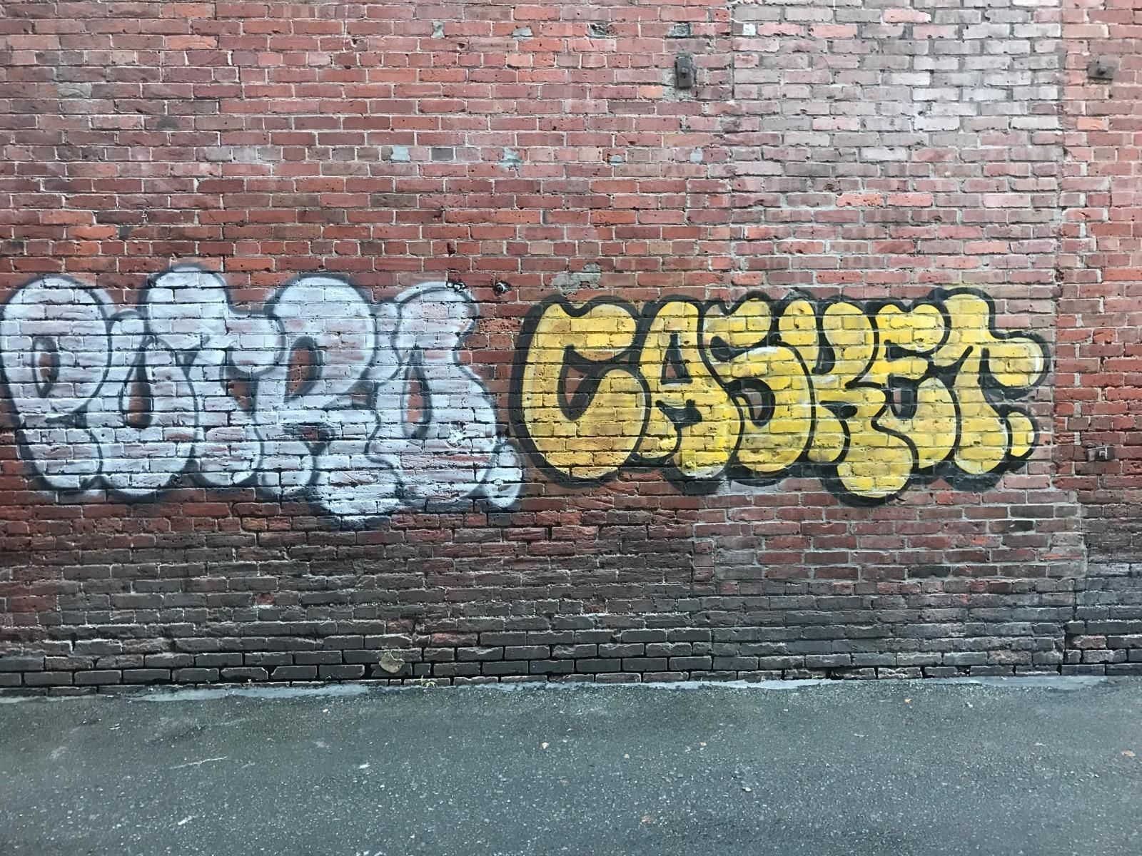 Graffiti on a brick wall: