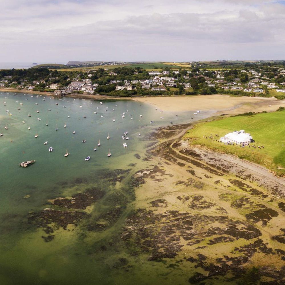 An aerial view of a large body of water with boats in it.