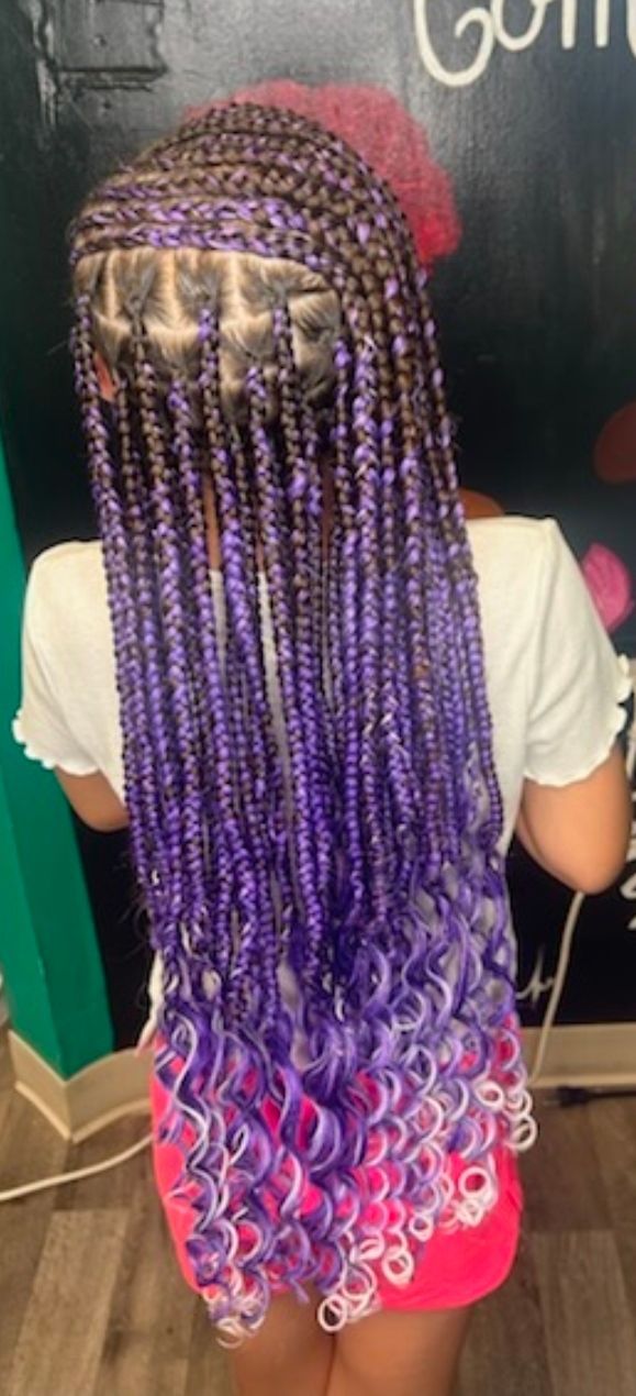 Back view of long purple box braids with pink and blue curls, worn over a white shirt