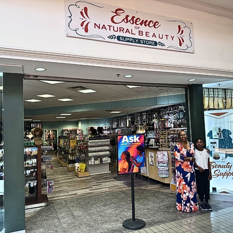 Natural beauty supply store entrance with shelves of hair and beauty products