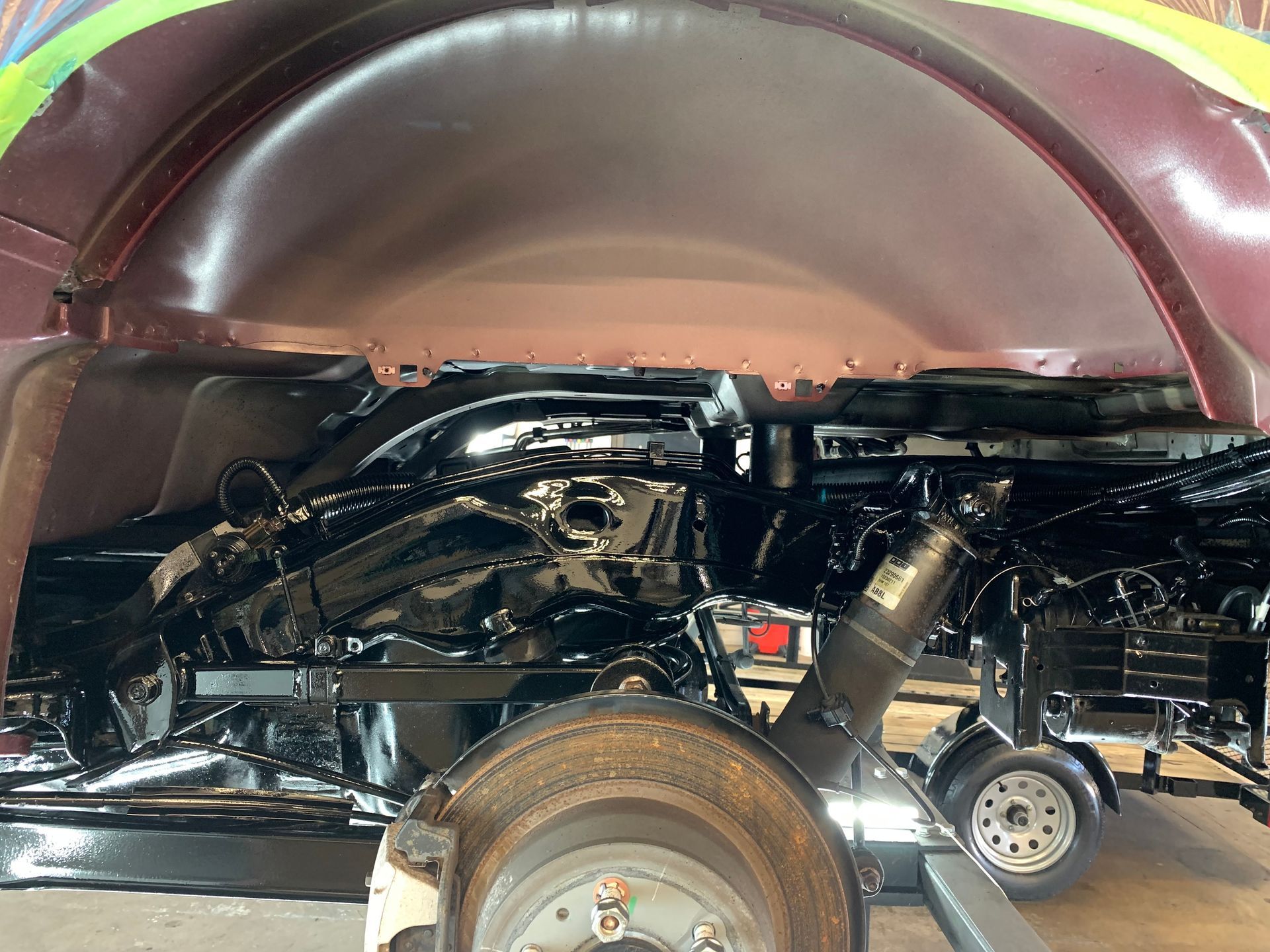 A car is being worked on in a garage.