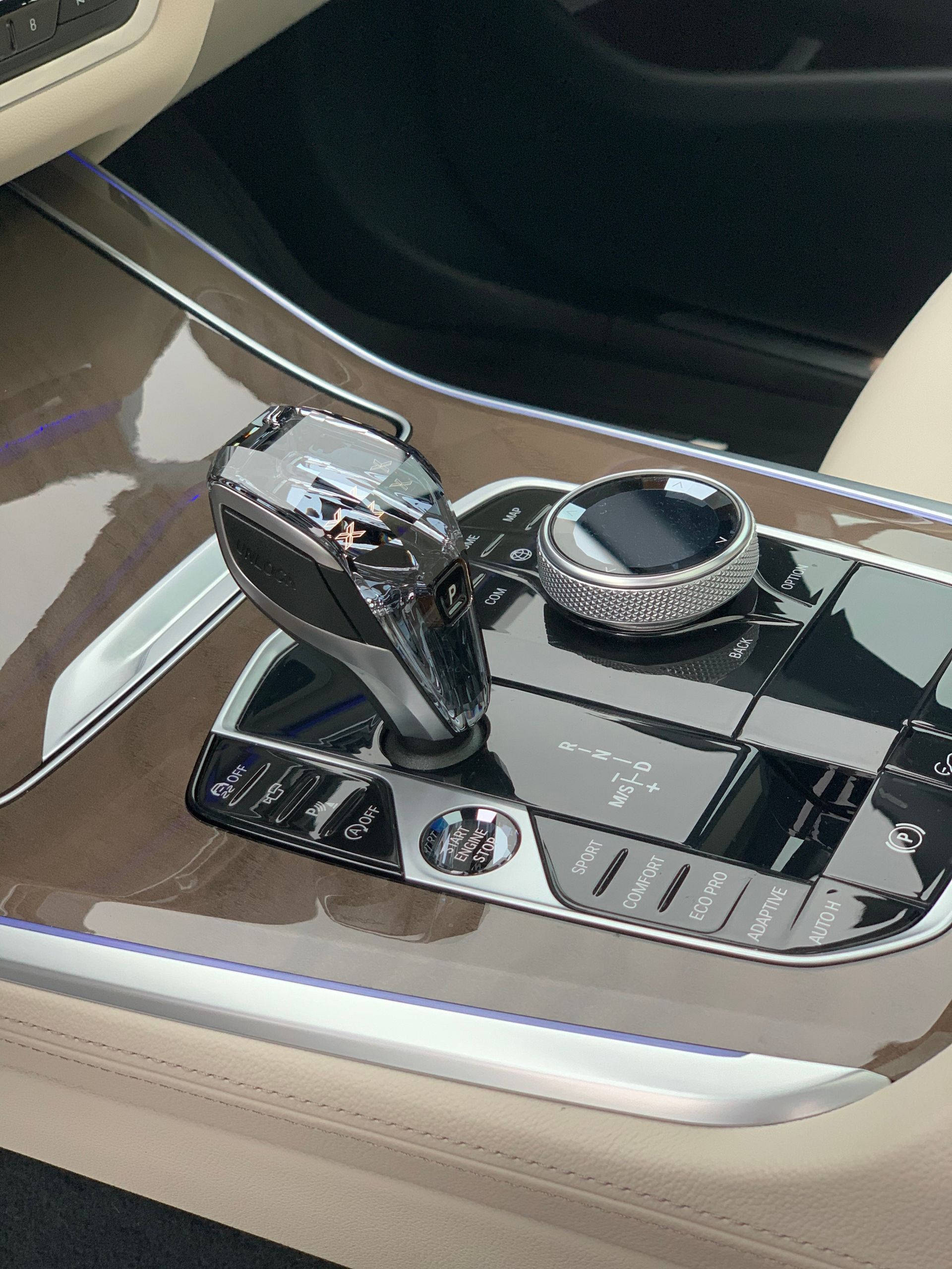 A close up of a car dashboard with a shifter