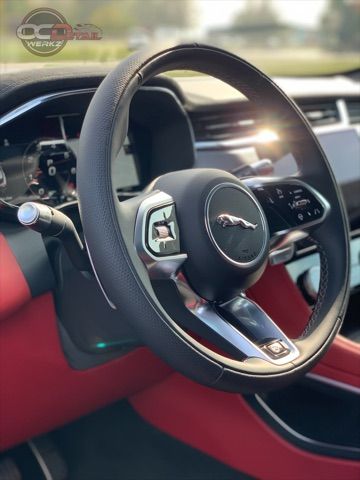 A close up of a steering wheel in a car.