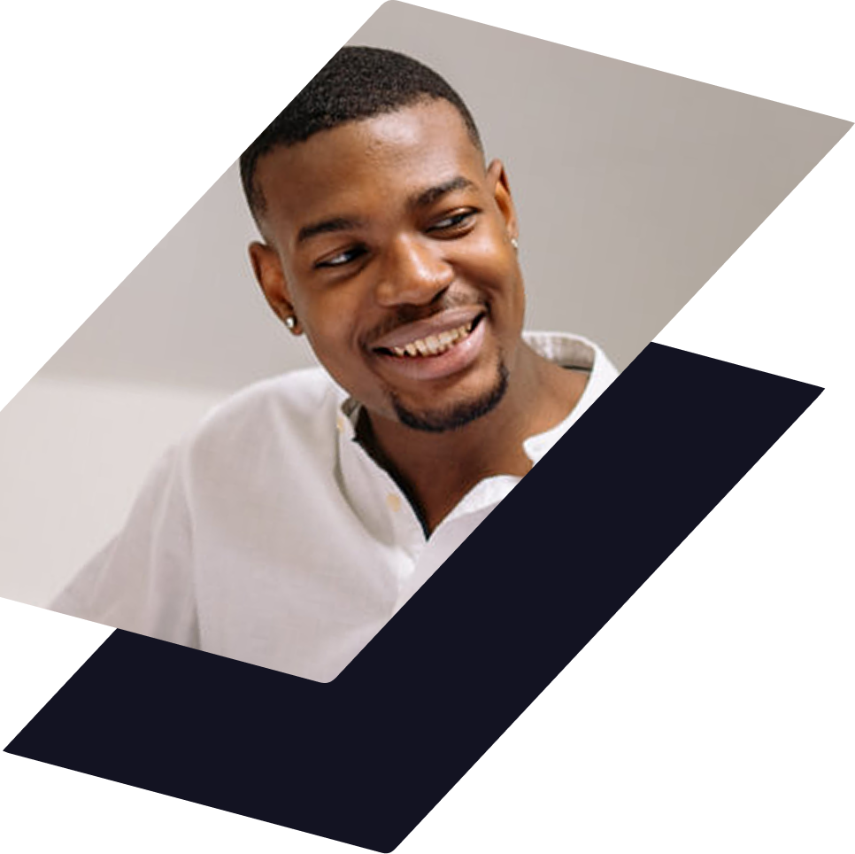 A smiling person wearing a white collared shirt, set against a geometric background of gray and dark blue.