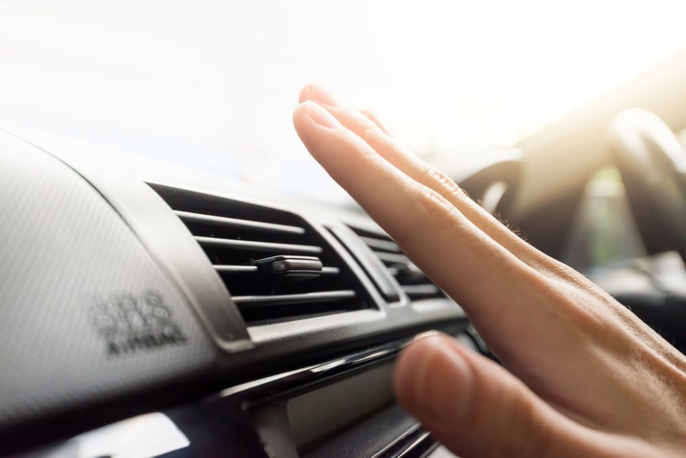 Person Adjusting The Air Conditioner In A Car — Erina Car Air Conditioning In Terrigal, NSW