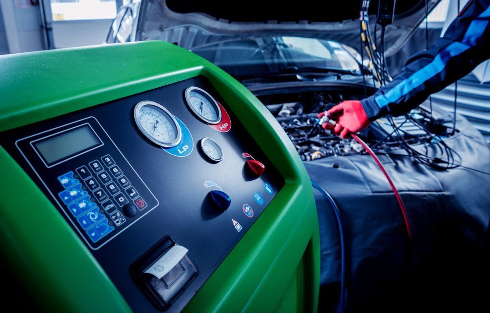 Man Working On A Car With The Hood Open — Erina Car Air Conditioning In Wyoming, NSW
