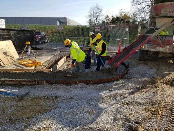 A group of construction workers are working on a construction site.