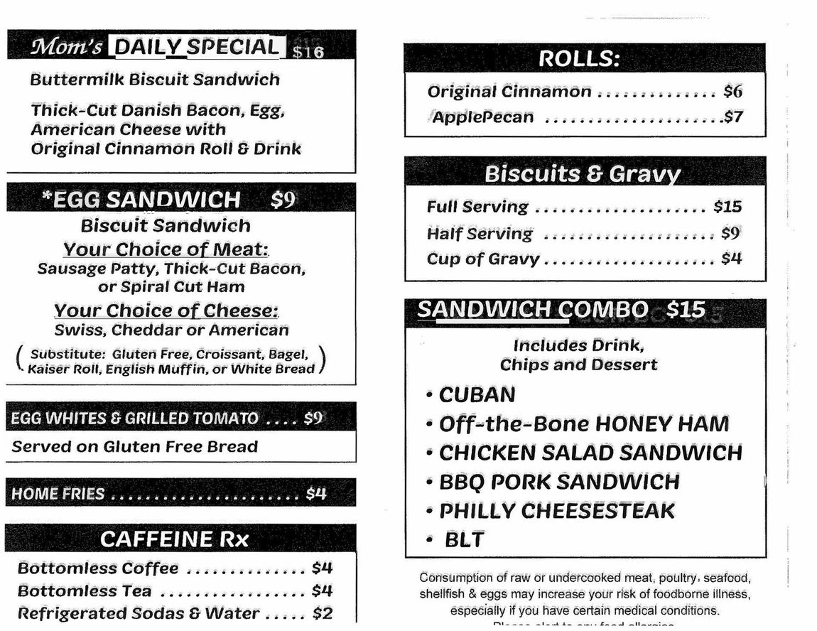 Menu board listing daily specials, egg sandwiches, rolls, biscuits & gravy, and sandwich combos.