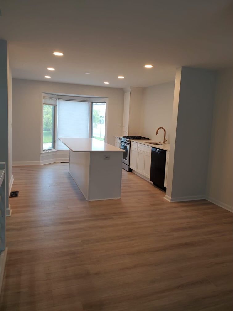 There is a large island in the middle of the kitchen.