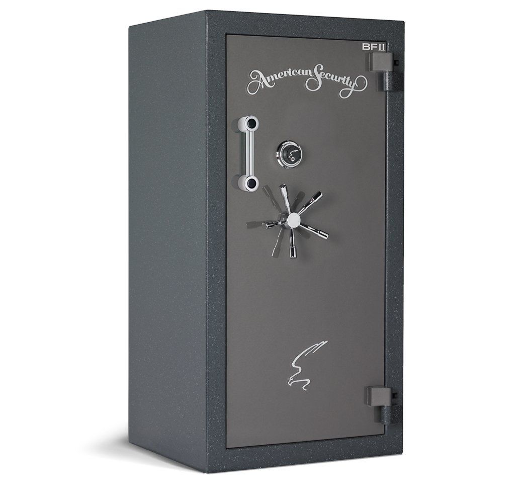 A black safe with a star on the door is sitting on a white surface.