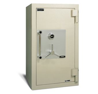 A white safe with a key on the door