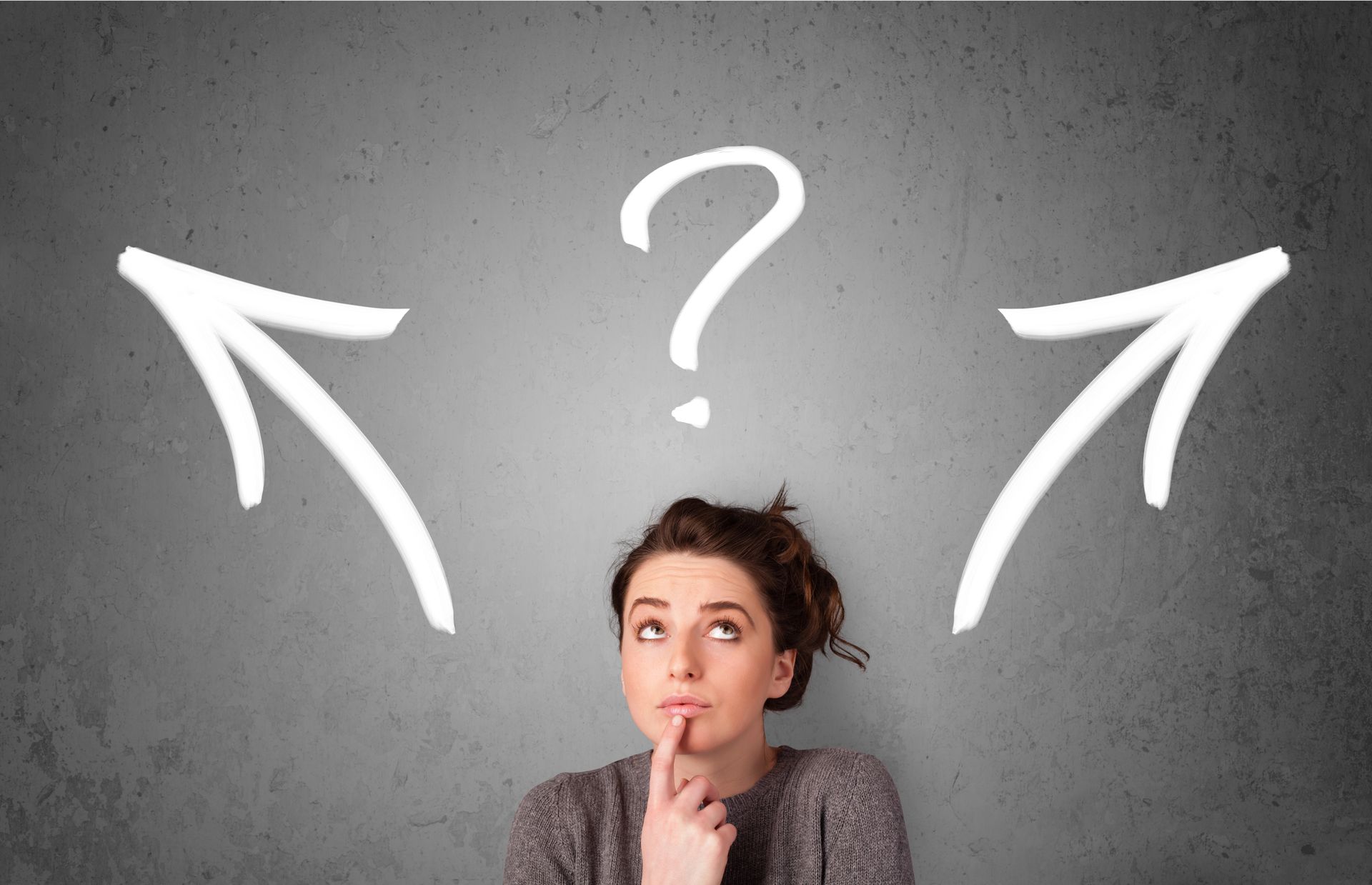 Woman looking thoughtful under a question mark with arrows pointing left and right.