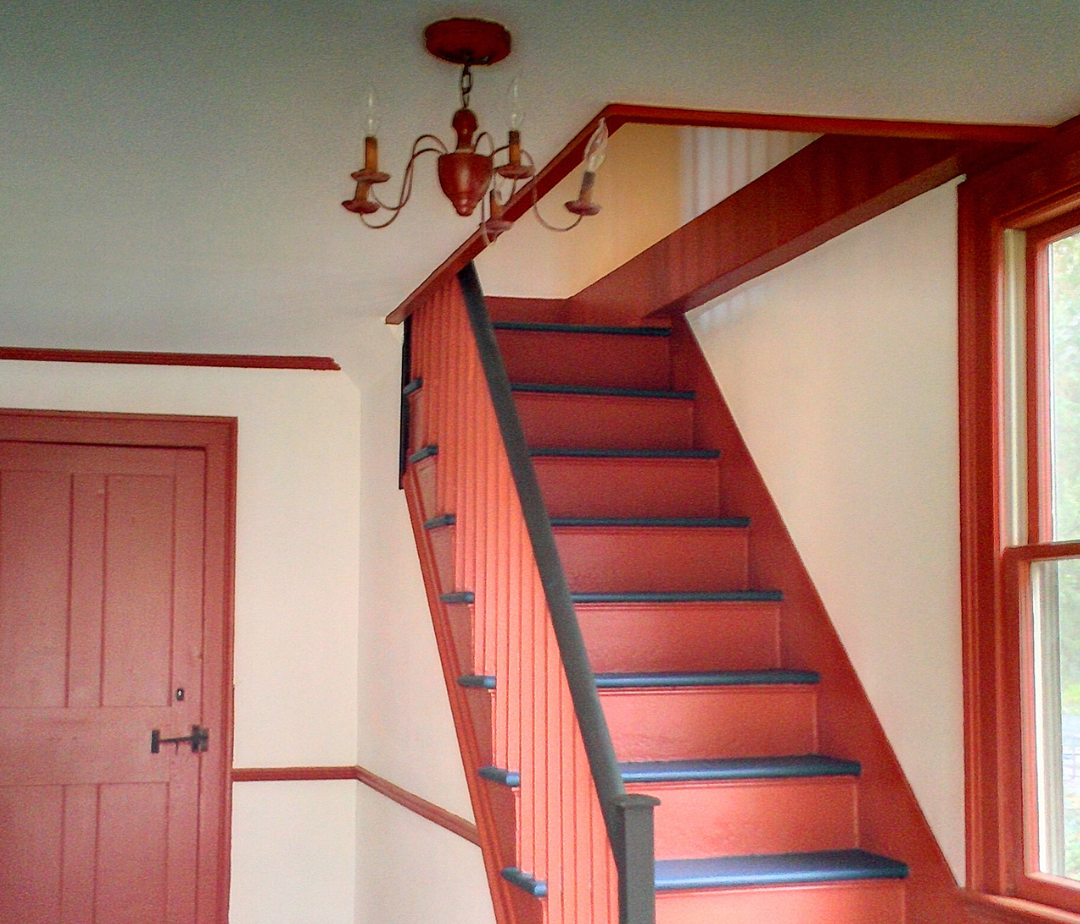 A picture of stairs and railing from painters in connecticut