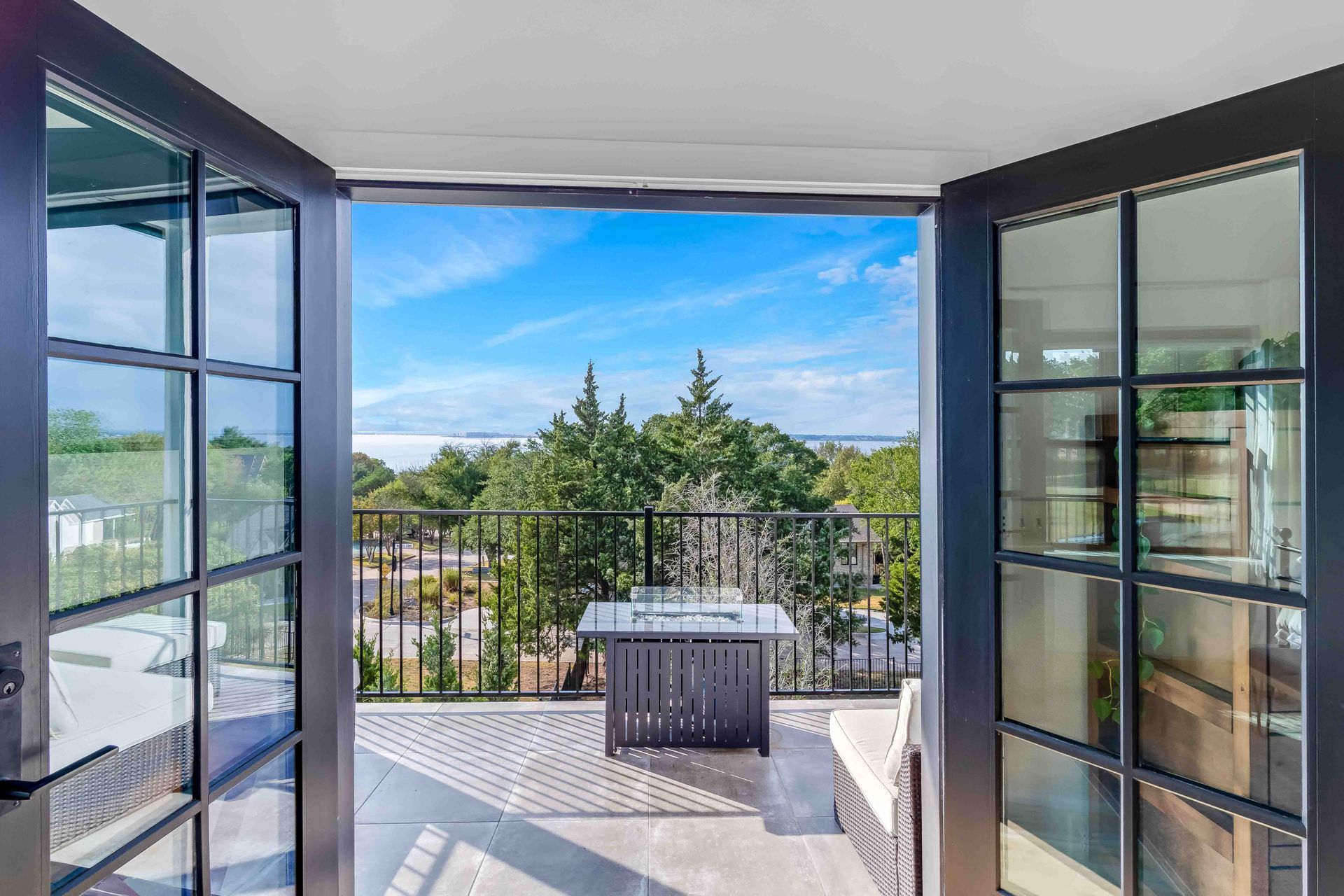 Open doors looking at water view that signifies a new future