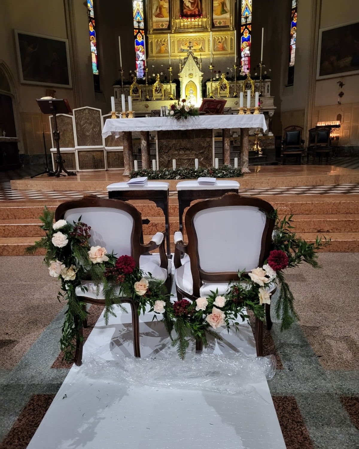 the church altar is decorated with flowers and candles