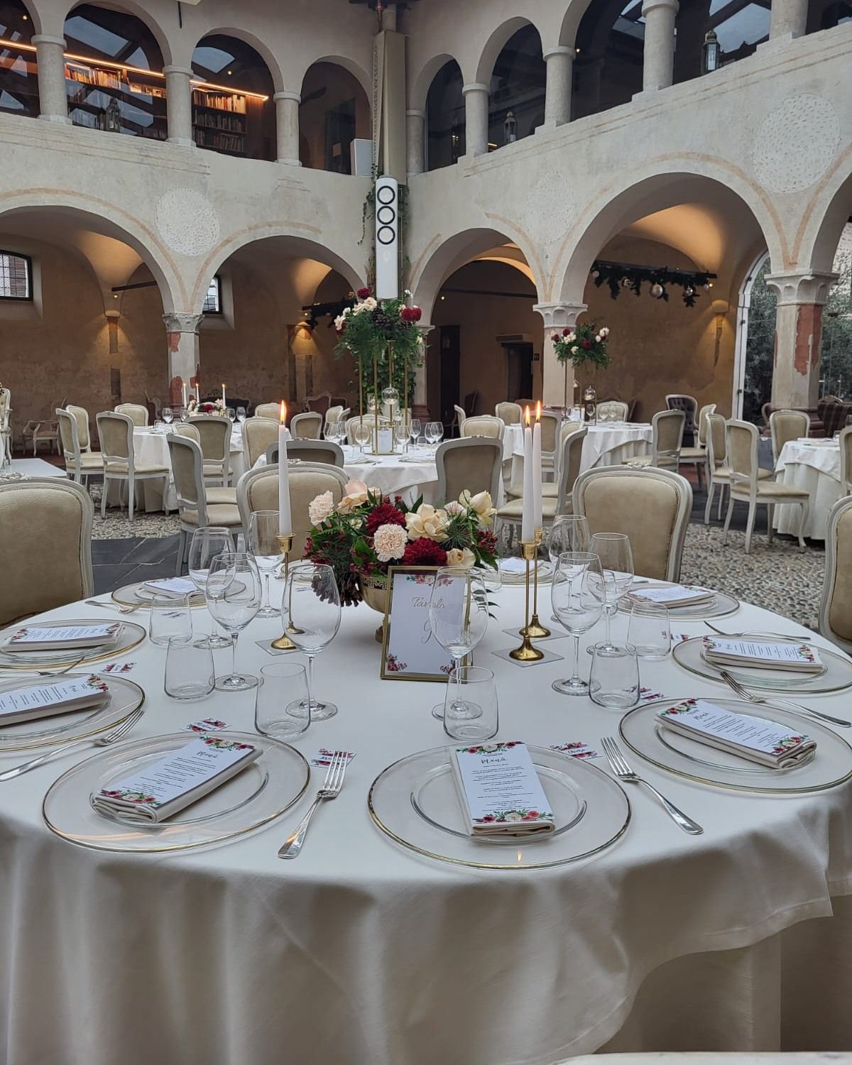 a wedding table with flower centrepiece