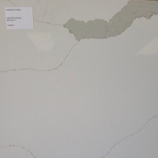 Damaged white wall with peeling paint and a small label in the upper left corner