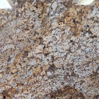 Close-up of a speckled tan, gray, and brown stone or granite surface