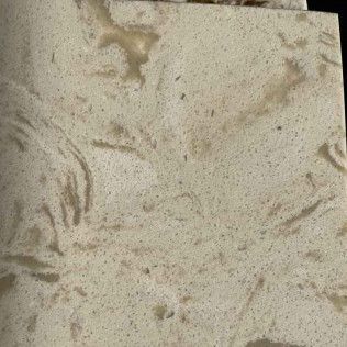 Close-up of a beige sandy surface with scattered footprints and smudges