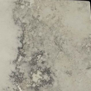 Gray and black marbled stone or concrete surface with mottled texture