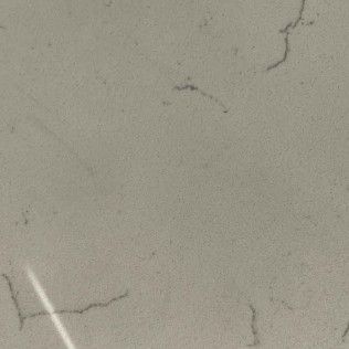 Cracked light gray wall or ceiling with a white pipe or trim in the lower left corner