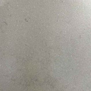 Plain gray textured surface with faint speckles and subtle shadows