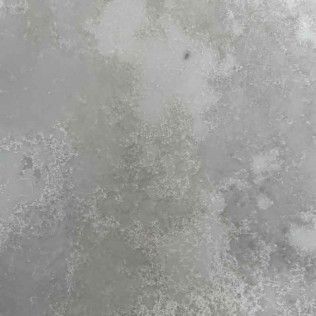 Gray textured surface with mottled light and dark patches