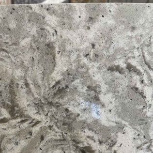 Gray marble-like stone surface with dark veining and mottled texture